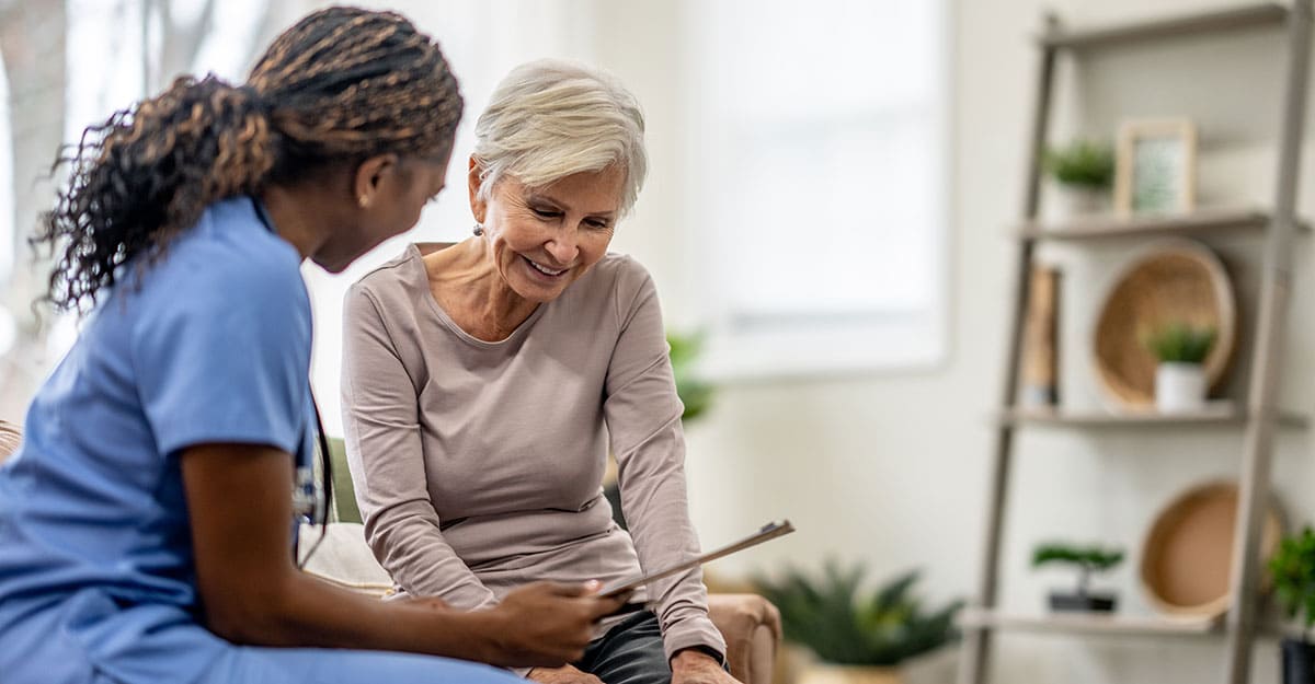 Nurse educating patient and family member