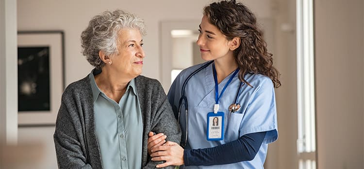 Skilled nurse caring for patient at home